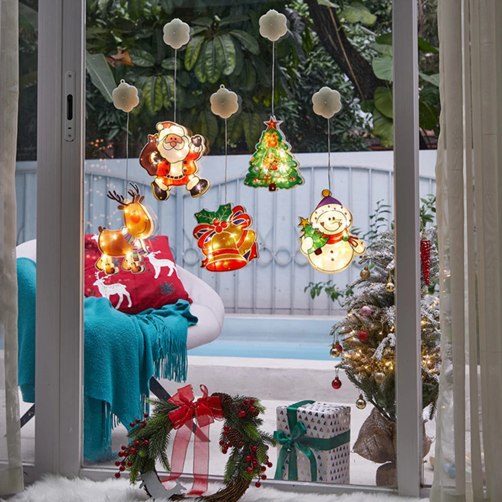 trang trí noel cho cửa kính với hình người tuyết 